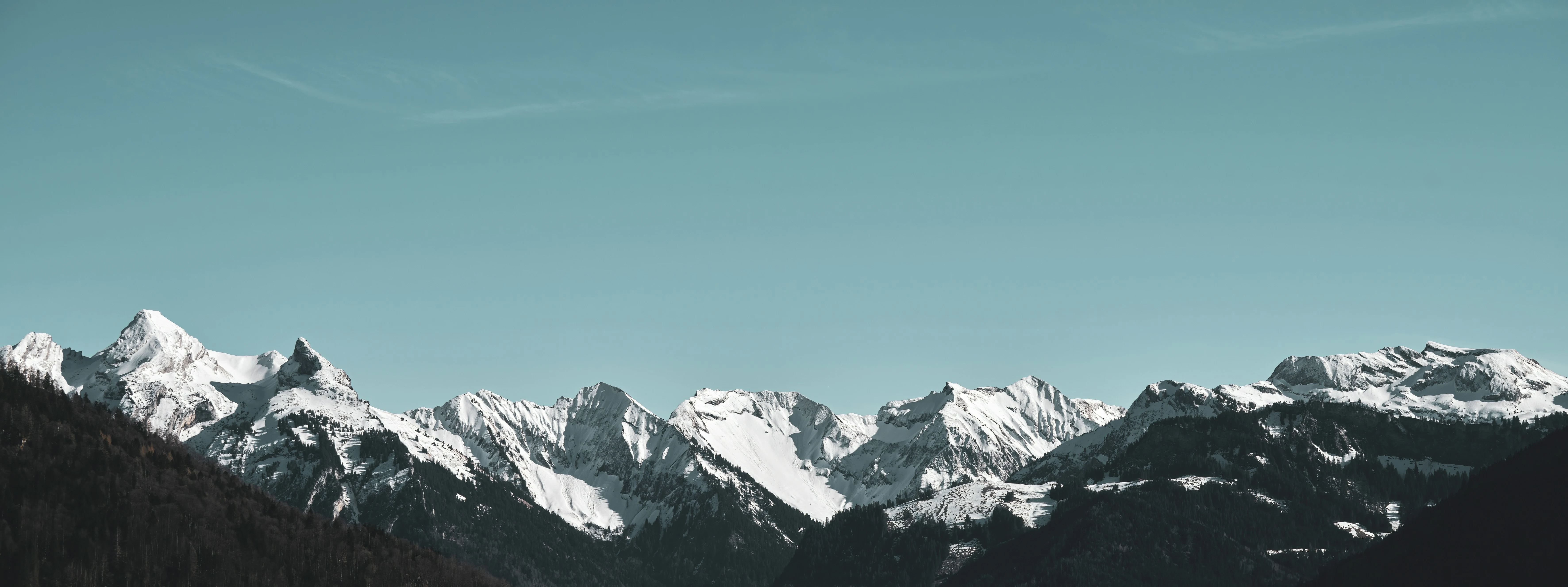 Beautiful mountain landscape with snow-covered ski slopes and trails